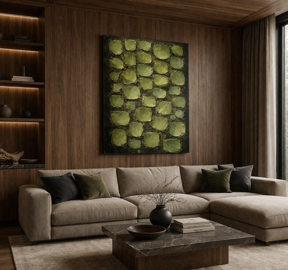 Tableau vert sauge accroché dans un salon zen ambiance naturelle et contemporaine
