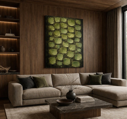Tableau vert sauge accroché dans un salon zen ambiance naturelle et contemporaine
