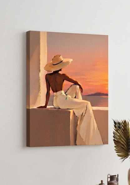 Tableau sur toile figuratif représentant une femme assise face à la mer, dans une lumière orangée
