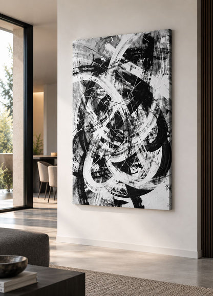 Tableau mural Collision noir et blanc présenté dans un salon contemporain
