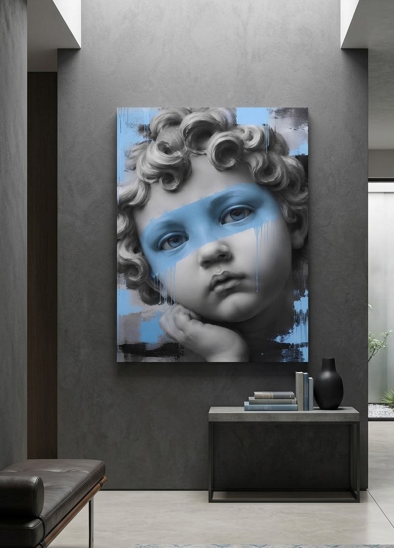 Tableau visage de statue classique revisité en noir et blanc avec des touches de bleu pour un intérieur contemporain.
